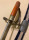 Egy antik kard vagy dísszablya - Szablya, díszes acél pengével, oroszlános markolattal, hüvelyében Kép